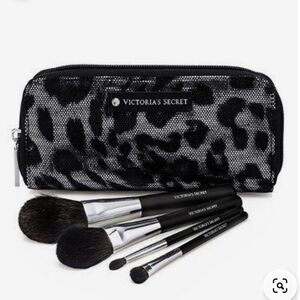 Victoria's Secret makeup brushes in a black and silver zipper makeup bag